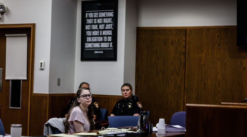 Addy Michaels, center, waits for her attorneys during a sidebar at the opening of her trail at Montgomery County Common Pleas Court on Monday morning, June 5, 2023. JIM NOELKER/STAFF