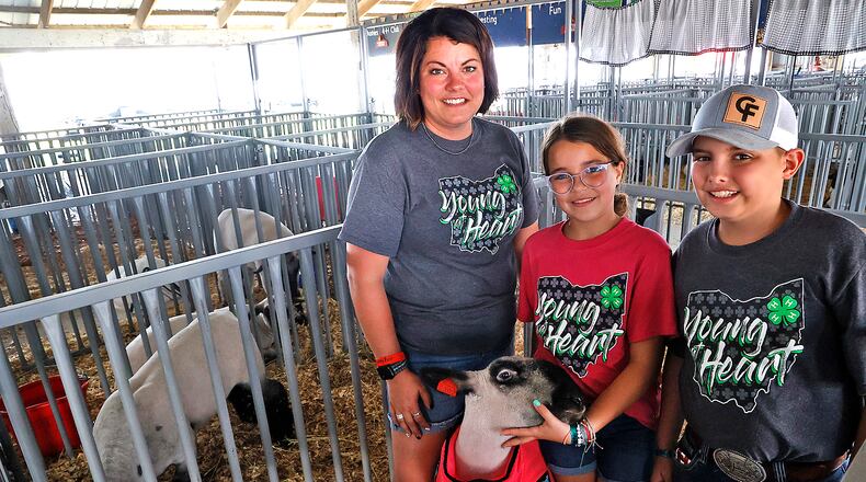 The Clem family has been participating in 4-H at the Clark County Fair for generations and now Heather Clem helps her kids, Hallie and Bentlee, show animal projects. BILL LACKEY/STAFF
