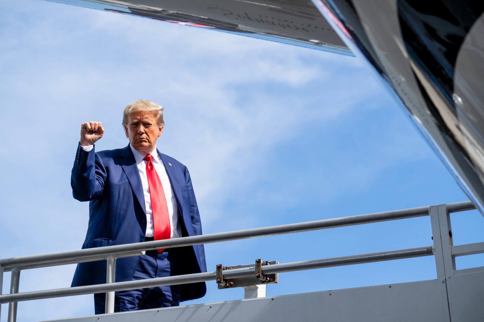
                        Former President Donald Trump gestures as he boards his plane in Miami, June 13, 2023. Trump pleaded not guilty in federal court in Miami on Tuesday to criminal charges that he risked disclosure of defense secrets and obstructed the government’s efforts to reclaim classified documents he took with him upon leaving office. (Doug Mills/The New York Times)
                      