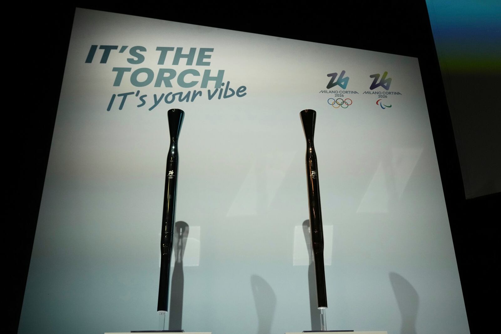 Milano Cortina 2026 Winter Olympics and Paralympics torches are displayed during the unveiling ceremony in Milan, Italy, Monday, April 14, 2025. (AP Photo/Antonio Calanni)
