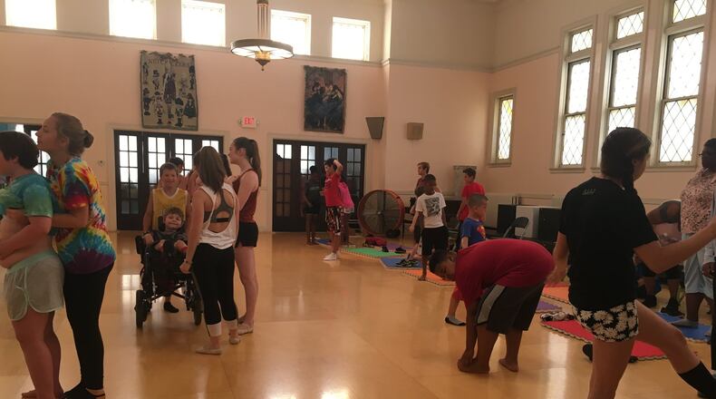 Ohio Performing Arts Institute dancers and Salvation Army Day campers prepare to learn several dances Monday.