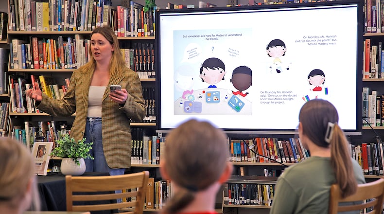Hannah Spitzer, a former Shawnee High School student, talks about publishing the children's book she wrote and illustrated Friday, April 19, 2024 at her alma mater. BILL LACKEY/STAFF