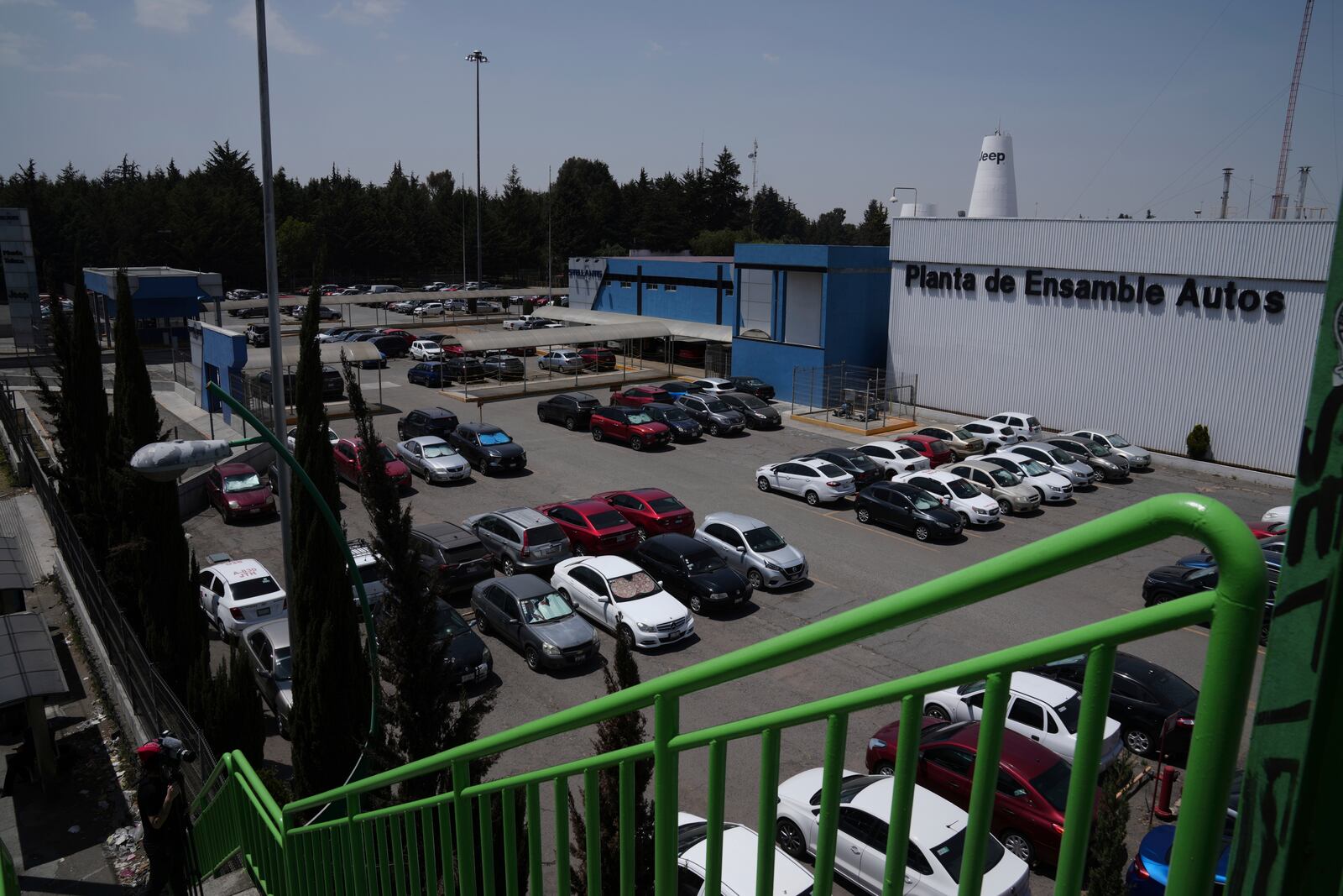 Cars are parked outside the Stellantis car assembly plant in Toluca, Mexico, Thursday, April 3, 2025. (AP Photo/Marco Ugarte)