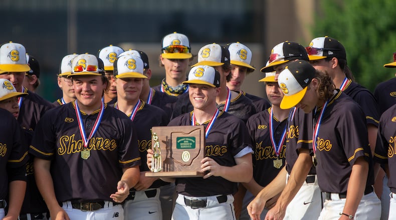 Shawnee winning pitcher Luke Myers holds the trophy after he and his teammates defeated Cincinnati Summit Country Day 4-1 to win the Braves' first district title since 2013. Jeff Gilbert/CONTRIBUTED