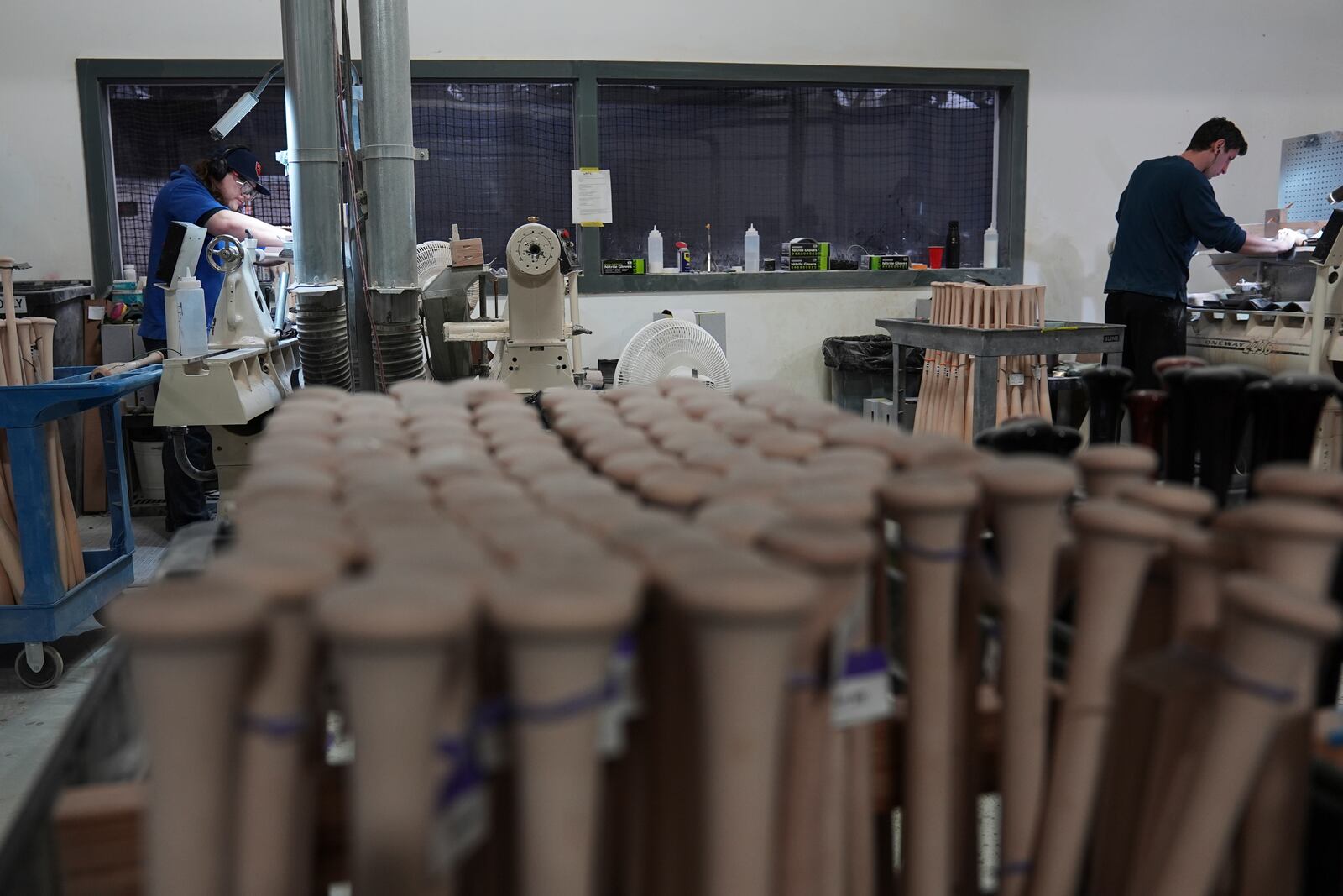 Tom Quirk, left, and Jim Levasseur manufacture torpedo baseball bats at Victus Sports in King of Prussia, Pa., Wednesday, April 2, 2025. (AP Photo/Matt Rourke)
