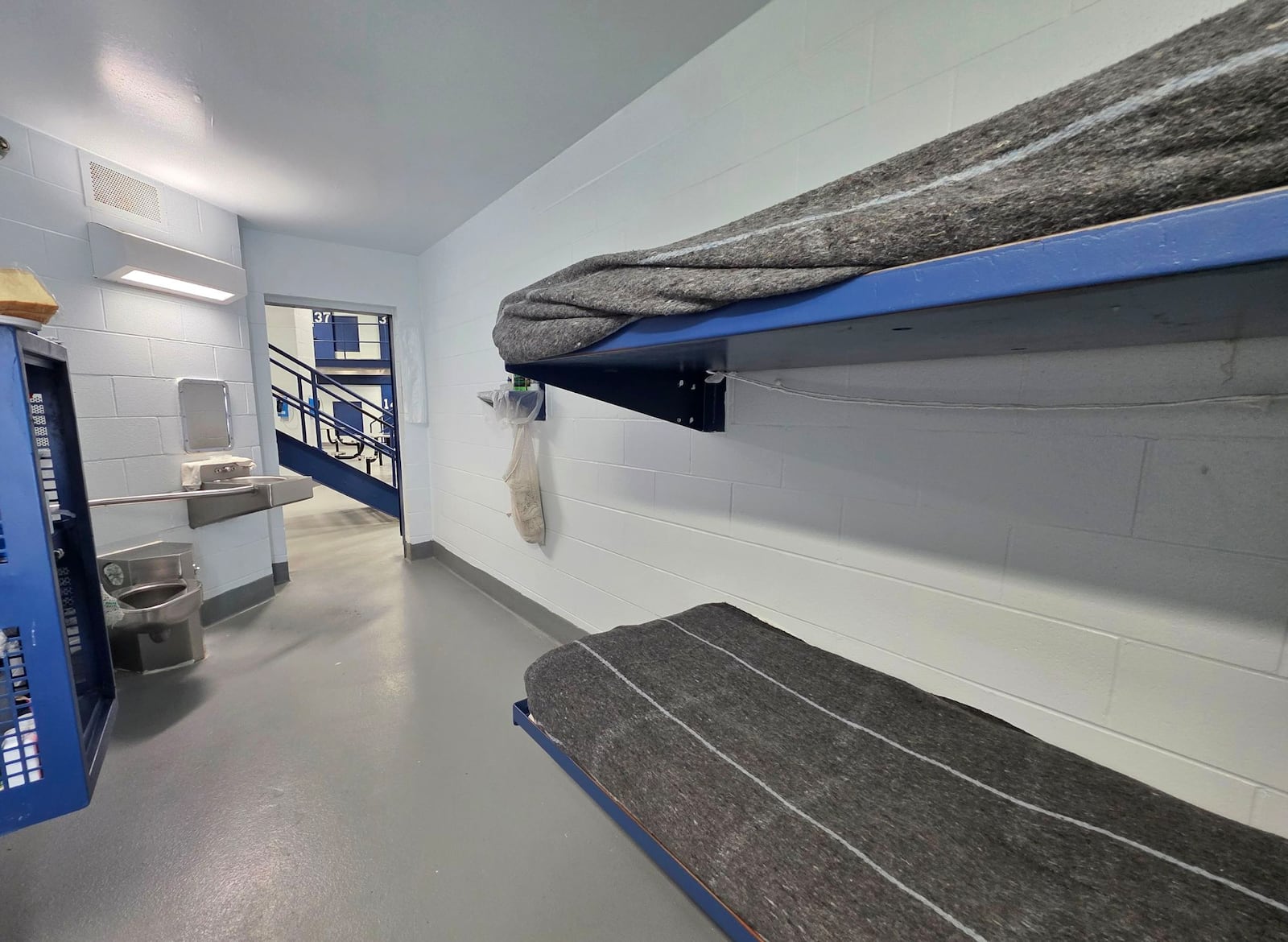 Butler County Sheriff Richard Jones has taken a hard stance on immigration since taking office more than two decades ago. He had 10 deputies credentialed to serve as ICE agents in the county, and said he plans to have more deputies eventually go through the training. Pictured is inside one of the 860 jail cells that features stacked beds, a stainless-steel toilet and sink, and a color television. on Wednesday, July 16, 2025. NICK GRAHAM/STAFF