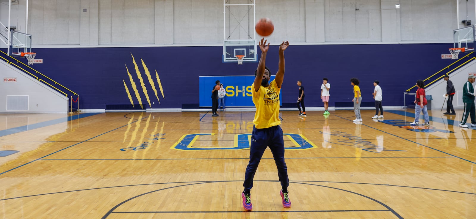 Mike Wallace, center, shoots a free throw in a gym during a tour as part of "The Dome Experience" at the Dome on Wednesday, March 25, 2026, in Springfield. JOSEPH COOKE/STAFF