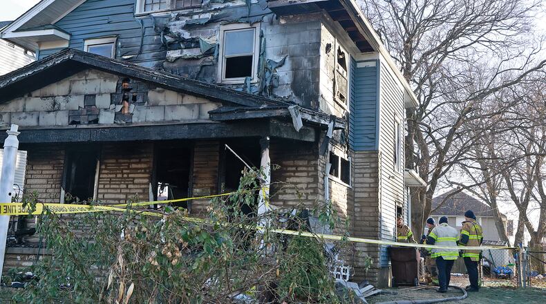 Two people were killed in a house fire early Saturday, Dec. 14, 2024 in the 1800 block of South Center Blvd. The Springfield Fire & Rescue Division arrived to find the front of the house fully engulfed in flames. As the firefighters tried to make entry into the house, one of the firefighters legs went through the floor so they had to attack the fire from the outside. BILL LACKEY/STAFF