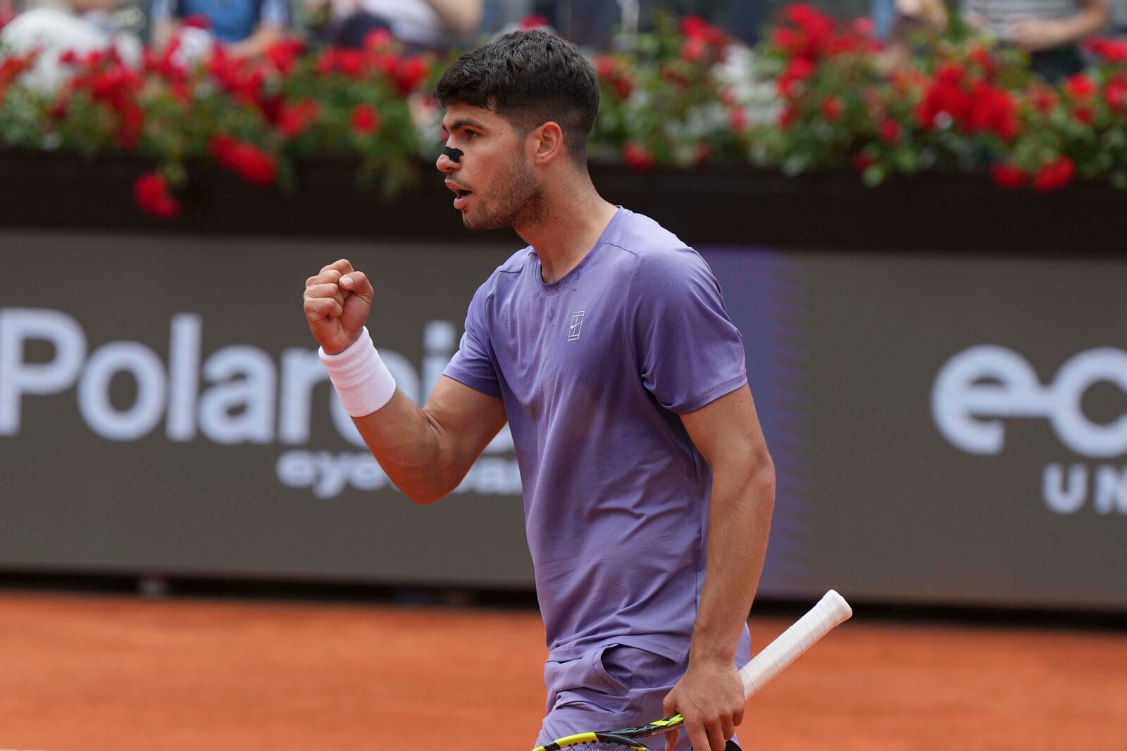 Spain's Carlos Alcaraz celebrates a point from Serbia's Dusan Lajovic during the Italian Open tennis tournament in Rome, Friday May 9, 2025. (Alfredo Falcone/LaPresse via AP)