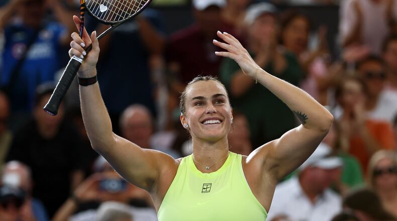 Aryna Sabalenka of Belarus waves to the crowd after winning the women's final match against Marta Kostyuk of Ukraine 6-4, 6-3, at the Brisbane International tennis tournament in Brisbane, Australia, Sunday, Jan. 11, 2026. (AP Photo/Tertius Pickard)
