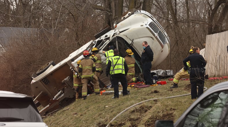 A tow truck driver struck a utility pole, flipped on a hill and is trapped inside as Springfield rescue crews work to free him.
The crash happened on Dayton Avenue between Clark and Pleasant streets about 12:10 p.m. Jan. 6, 2022.
BILL LACKEY/STAFF
