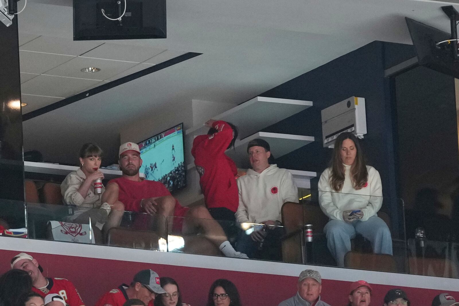 Singer Taylor Swift and her boyfriend Travis Kelce watch Game 4 of the NHL hockey Stanley Cup Final between the Florida Panthers and the Edmonton Oilers,Thursday, June 12, 2025, in Sunrise, Fla. (AP Photo/Lynne Sladky)