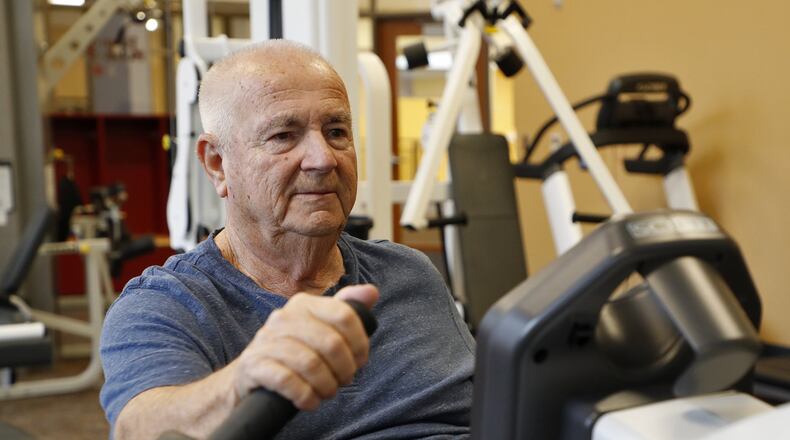 Richard Mitchell works out in the fitness room at United Senior Services in Springfield for an hour a day and has lost 40 pounds in the past year. Bill Lackey/Staff