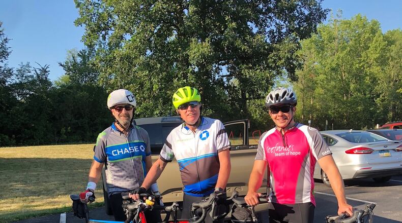 Larry Wiech, Craig Penney and Ryan Roll pose for a photo before their Pelatonia ride.