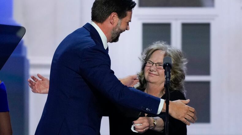 Republican vice presidential candidate Sen. JD Vance, R-Ohio, left, greeting his mother Beverly Vance, right, during the Republican National Convention on Wednesday, July 17, 2024, in Milwaukee. (AP Photo/J. Scott Applewhite)
