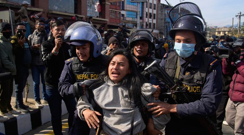 Nepalese police detain a young protester during an anti-government rally in Kathmandu, Nepal, on Dec. 22, 2025. (AP Photo/Niranjan Shrestha)