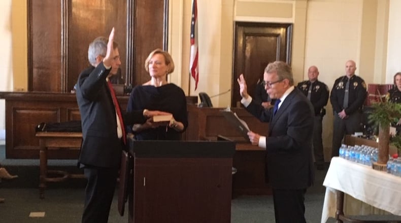 Clark County Municipal Court Judge Stephen Schumaker was sworn into office Friday by incoming Ohio governor Mike DeWine. STAFF