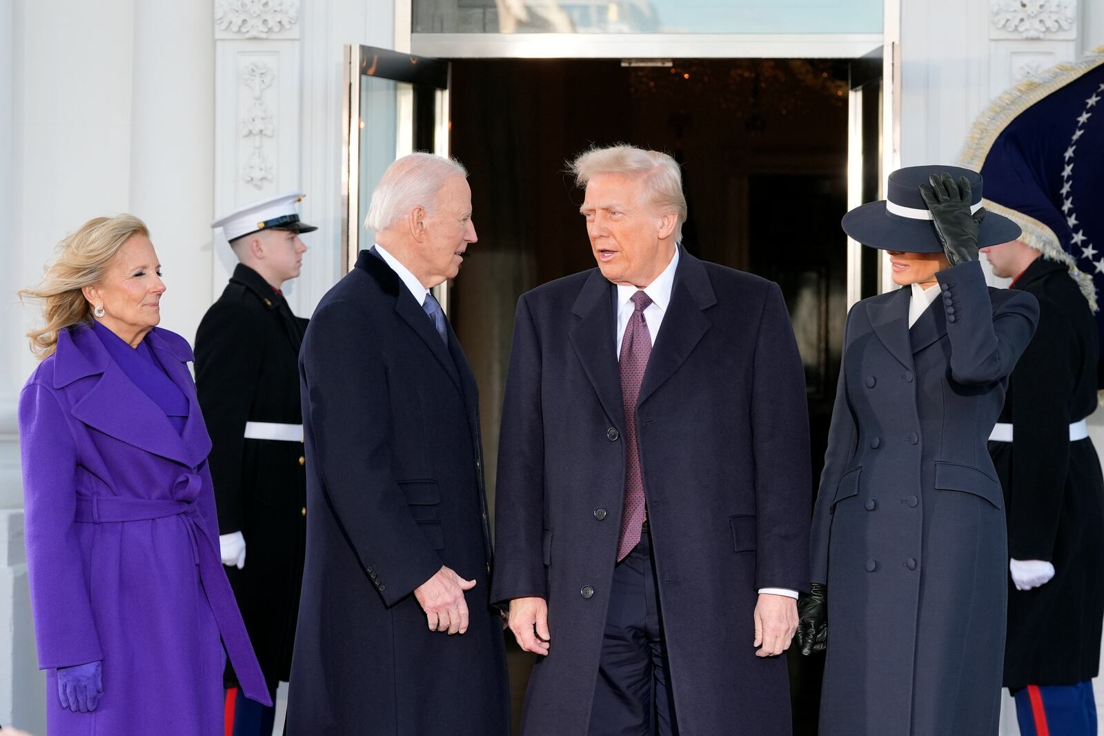 FILE - President-elect Donald Trump and Melania Trump are greeted by President Joe Biden and first lady Jill Biden, upon their arrival at the White House, Monday, Jan. 20, 2025, in Washington. (AP Photo/Alex Brandon, File)