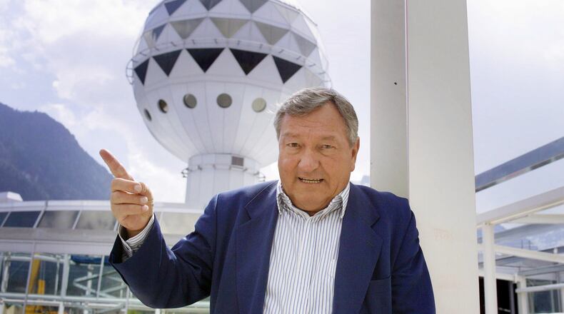 FILE - Erich von Daeniken, co-founder and co-owner of Mystery Park, poses in front of the Panorama Tower at Mystery Park in Interlaken, Wednesday, April 23, 2003. (Gaetan Ball)/Keystone via AP, File)
