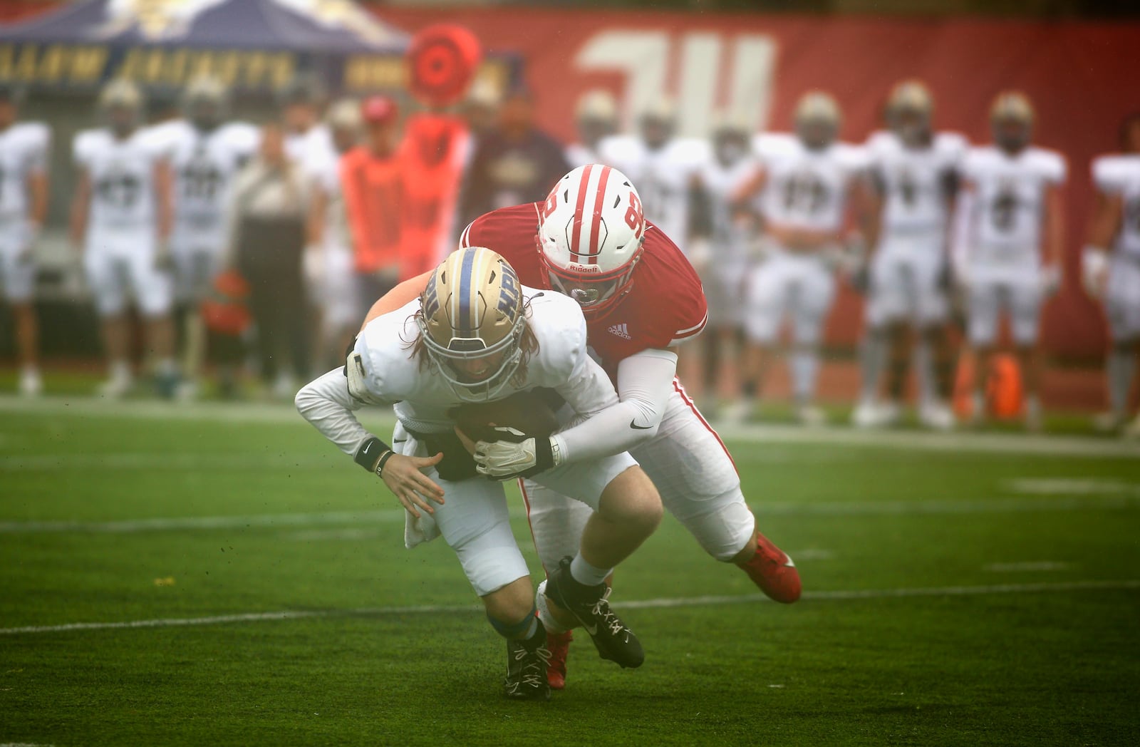 Wittenberg's Dalton Allen sacks Howard Payne's Zy Gravitt in the first quarter on Saturday, Sept. 28, 2024, at Edwards Maurer Field in Springfield. David Jablonski/Staff