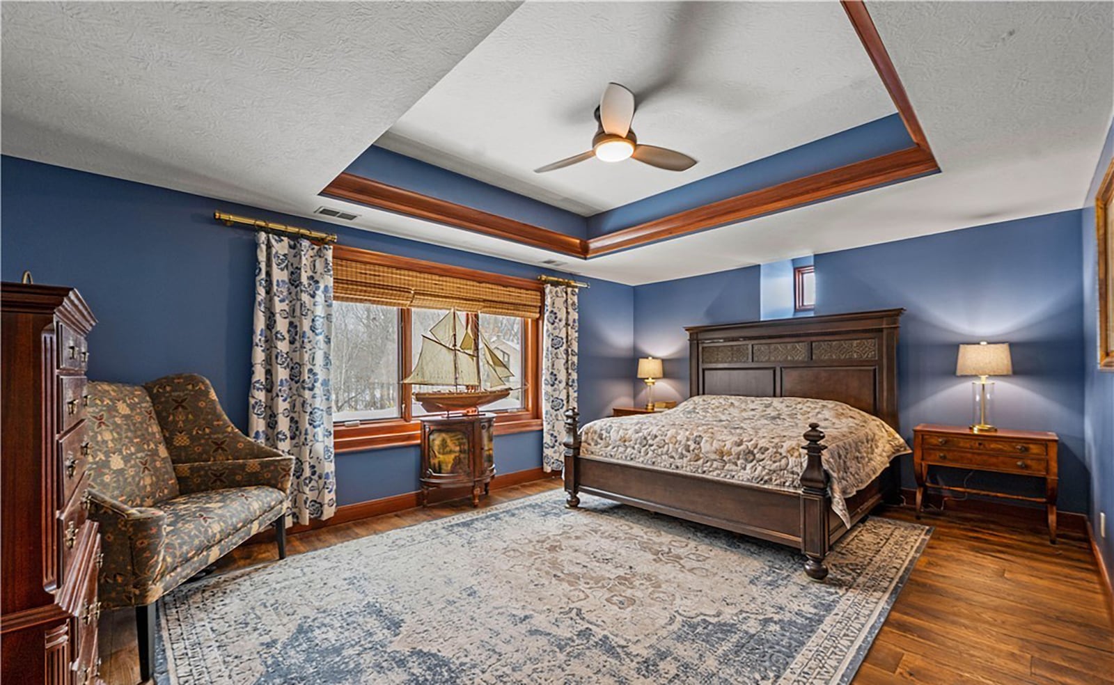 The second floor primary bedroom suite has a tray ceiling, ceiling fan, hardwood floors and an updated ensuite bathroom. CONTRIBUTED