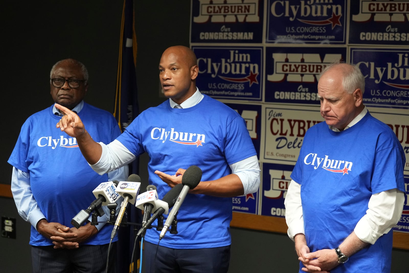 Maryland Gov. Wes Moore speaks to reporters as Rep. Jim Clyburn, D-S.C., left, and Minnesota Gov. Tim Walz look on at Clyburn's World Famous Fish, Friday, May 30, 2025, in Columbia, S.C. (AP Photo/Meg Kinnard)