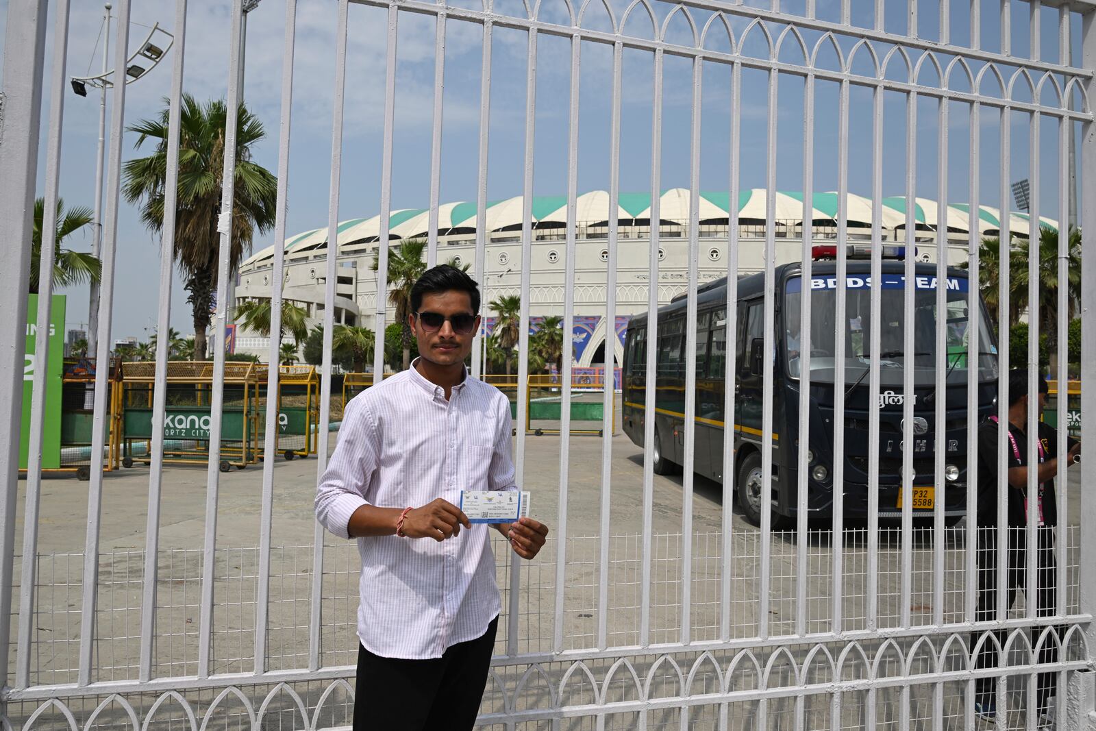 A fan displays his ticket outside a closed entrance of Atal Bihari Vajpayee Ekana Cricket Stadium after organizers suspended the Indian Premier League for one week following the escalating military tensions with Pakistan, in Lucknow, India, Friday, May 9, 2025. (AP Photo)