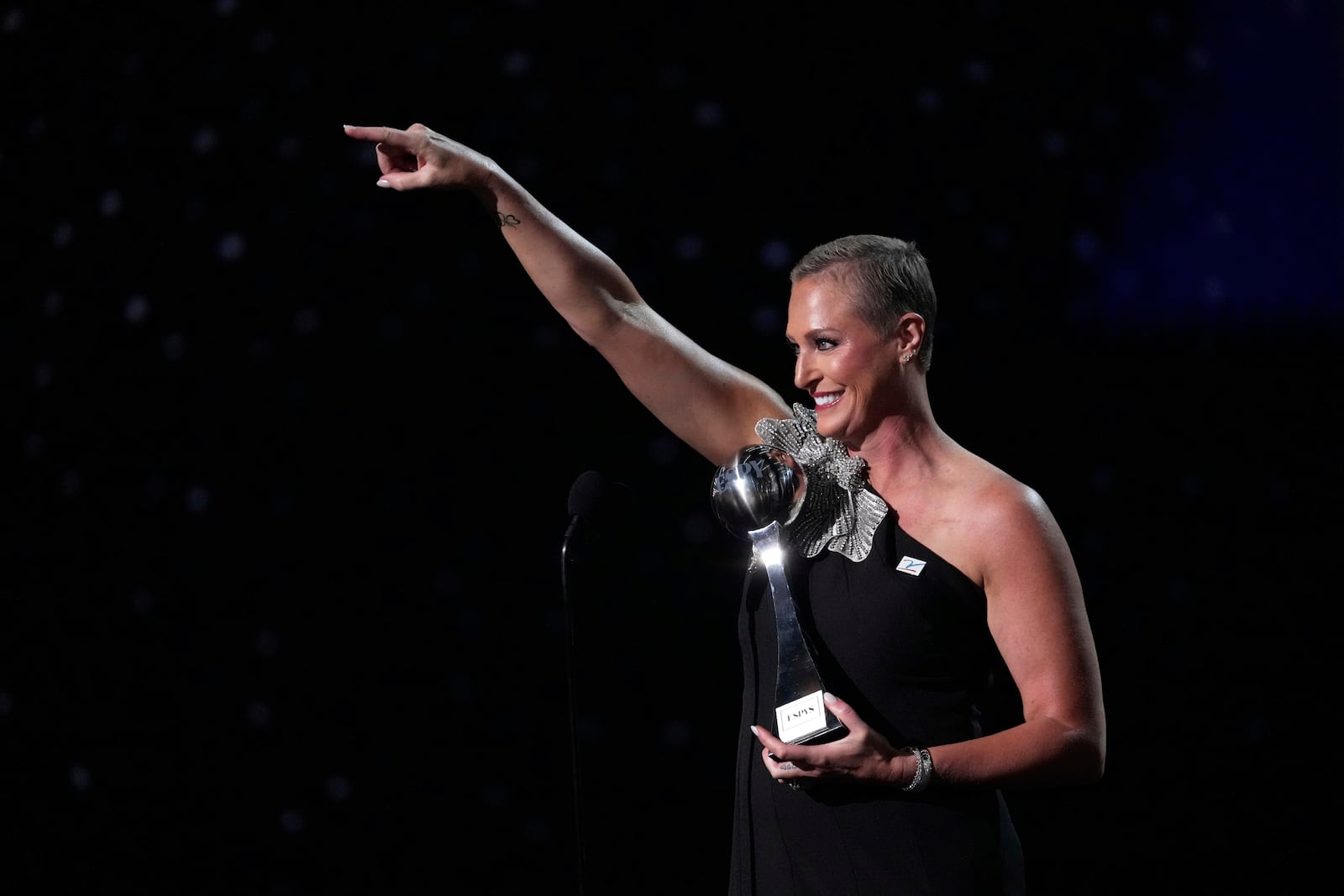 Katie Schumacher-Cawley accepts the Jimmy V Award for Perseverance at the ESPY Awards at the Dolby Theatre in Los Angeles, Wednesday, July 16, 2025. (AP Photo/Mark J. Terrill)