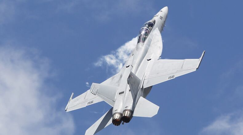 An F/A-18 Super Hornet performs at the Vectren Dayton Air Show in June. GE Aviation operations in Vandalia produce alternative generators for the fighter jet. TY GREENLEES/STAFF