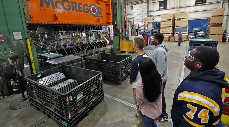 Springfield High School students look over a stamping press during a tour of McGregor Metalworkings’ OSMI plant in 2017. Bill Lackey/Staff