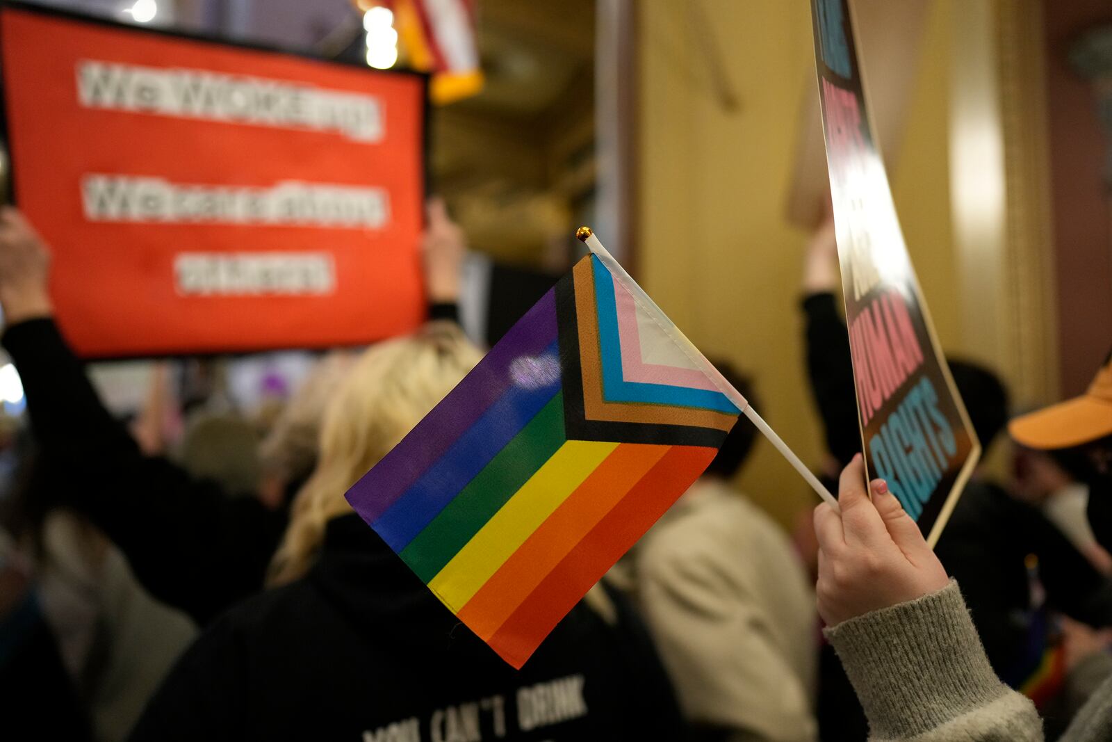 FILE - Protesters fill the Iowa state Capitol to denounce a bill that would strip the state civil rights code of protections based on gender identity, Thursday, Feb. 27, 2025, in Des Moines, Iowa. (AP Photo/Charlie Neibergall, File)