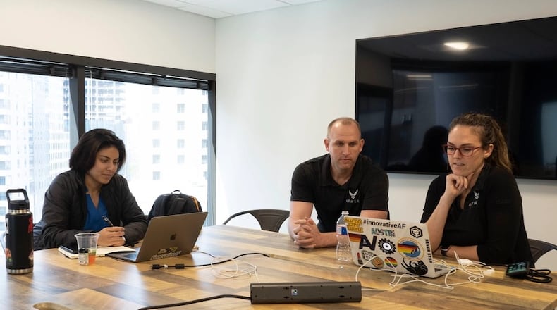 Members of the AFWERX Austin team listen to Small Business Innovation Research (SBIR) Phase I companies pitch their solutions as part of the technical selection process to Phase II during the Virtual Spark Collider and Pitch Bowl in Austin, Texas, March 13, 2020. Air Force photo by Staff Sgt. Jordyn Fetter
