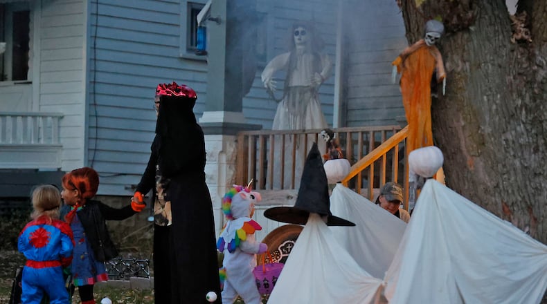 The sidewalks in Springfield were filled with ghouls and goblins with the occasional super hero and princess thrown in for good measure Saturday night, Oct. 29, 2022 during this year's Trick or Treat in Clark County. Kids of all ages went door to door to houses, some with elaborate decorations, filling their bags with sweet treats. BILL LACKEY/STAFF