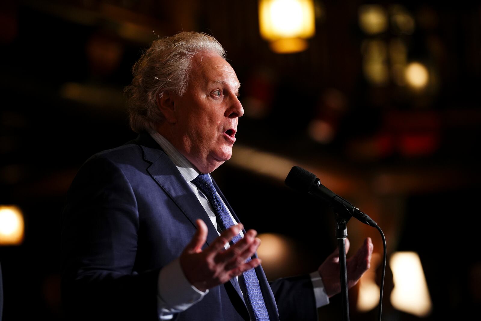 FILE - Former Quebec Premier Jean Charest speaks to reporters during a Cabinet retreat in Montebello, Quebec, Jan. 21, 2025. (Sean Kilpatrick/The Canadian Press via AP File)