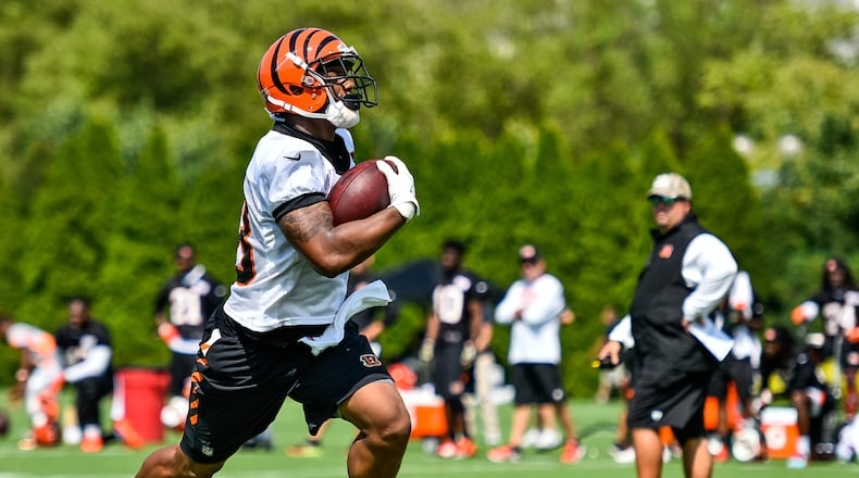 Running back Joe Mixon carries the ball during the first day of Cincinnati Bengals Training Camp Friday, July 28 at the practice fields beside Paul Brown Stadium in Cincinnati. NICK GRAHAM/STAFF