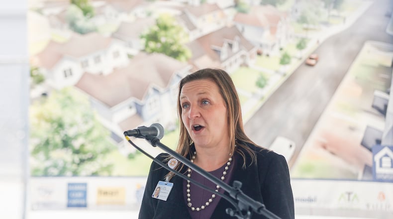 Jessica Salem, executive director of the Center for Community Health at Dayton Children's Hospital, speaks during a press conference before the Dayton Children's Kinship Housing tour on Monday, October 27, 2025, in Dayton . JOSEPH COOKE/STAFF