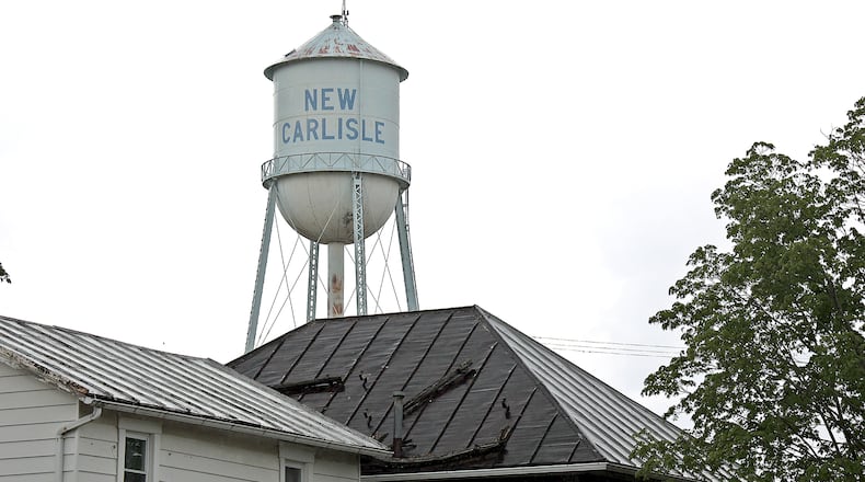 The Adams Water Tower, for decades a fixture in the sky over New Carlisle, will be demolished starting Monday. BILL LACKEY/STAFF