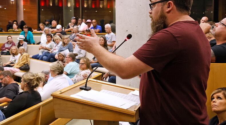 Springfield resident and business owner Brandon Ellis speaks in support of Haitian immigrants at the Springfield City Commission meeting Tuesday, Sept. 12, 2023. BILL LACKEY/STAFF