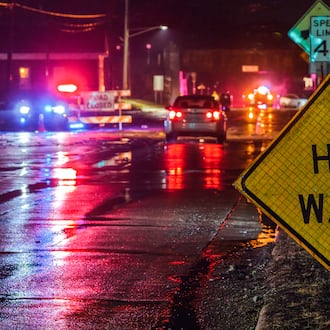 A crew from Ohio Department of Transportation works to clear drains on a flooded Germantown Road early Thursday morning, March 5, 2026 in Madison Township in Butler County. Heavy rain caused flooding in many areas. NICK GRAHAM/STAFF