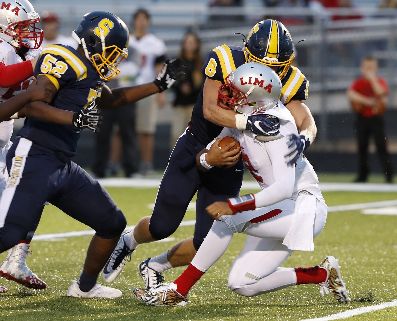 Springfield’s Cameron Hoelscher sacks Lima Senior quarterback Adrine Mitchell during Friday’s game. Bill Lackey/Staff