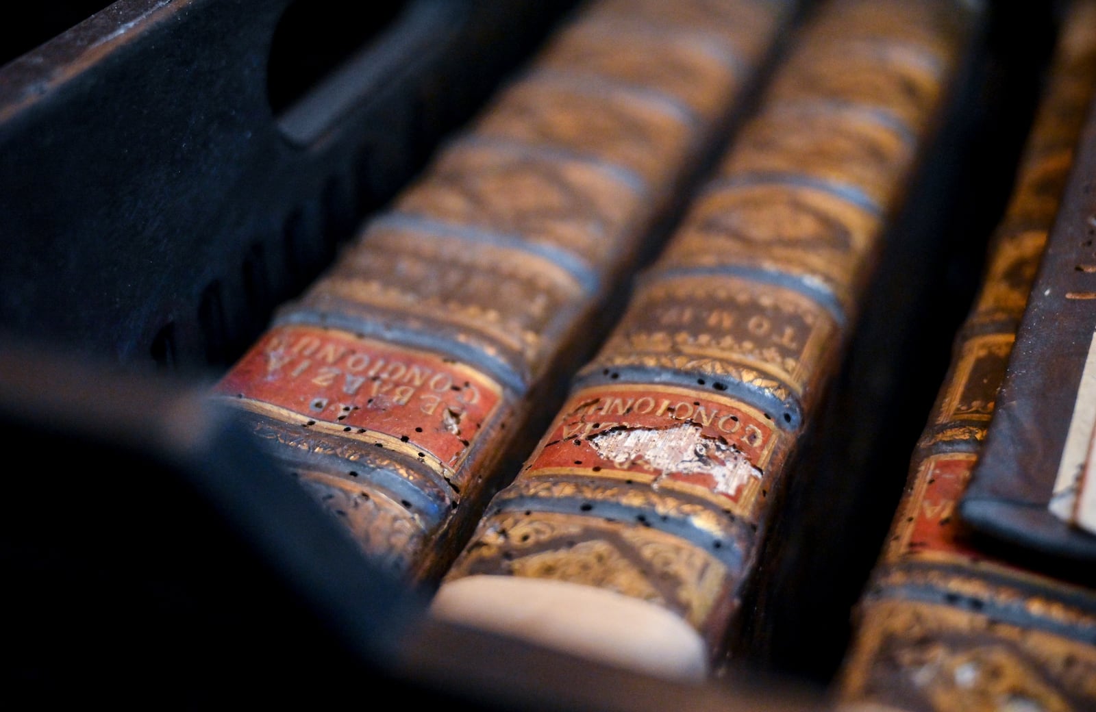 This photo provided by Pannonhalma Archabbey shows structural damage of old books due to a drugstore beetle infestation, at the Pannonhalma Archabbey's library in Pannonhalma, Hungary, Thursday, July 3, 2025, as a beetle infestation threatens its ancient collection. (Pannonhalma Archabbey via AP)