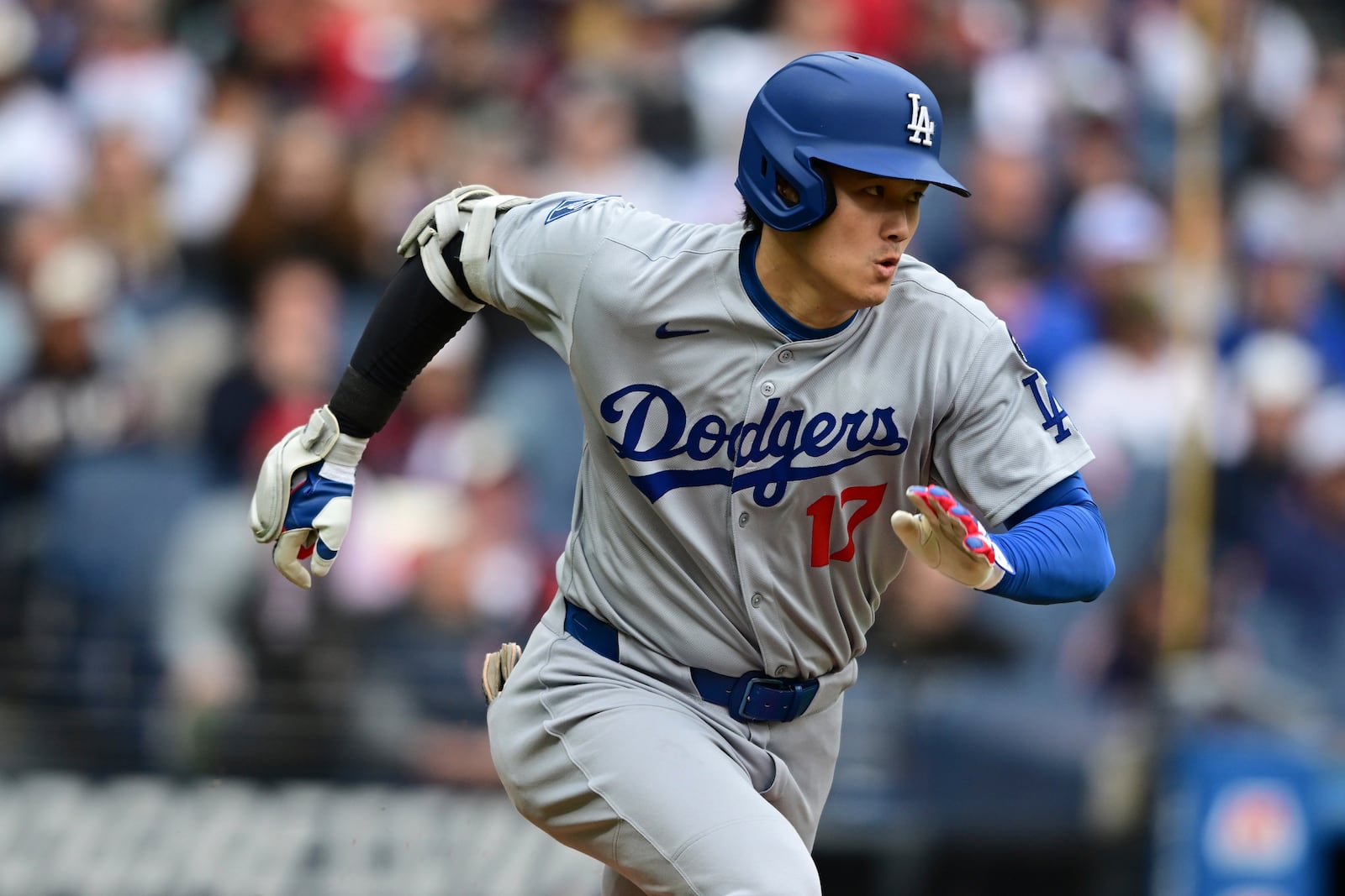 Los Angeles Dodgers' Shohei Ohtani runs after grounding out during the third inning of a baseball game against the Cleveland Guardians, Wednesday, May 28, 2025, in Cleveland. (AP Photo/David Dermer)