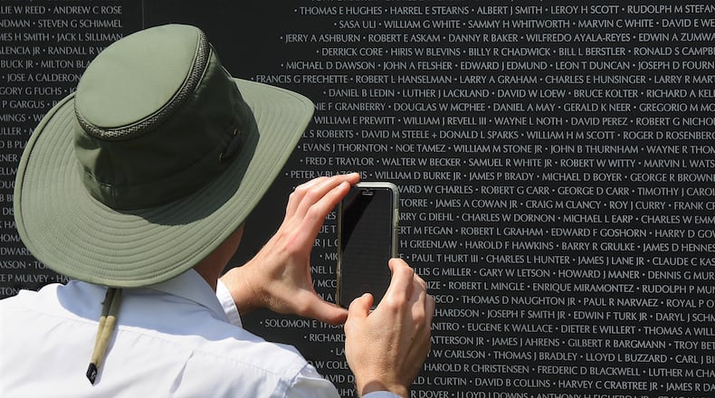 Thousands of people came to see the American Veterans Traveling Tribute Vietnam Memorial Friday, Aug. 19, 2022, at the National Museum of the United States Air Force. This 80% replica of the Vietnam Wall bears the names of more than 58,000 service members killed in Southeast Asia. MARSHALL GORBY / STAFF