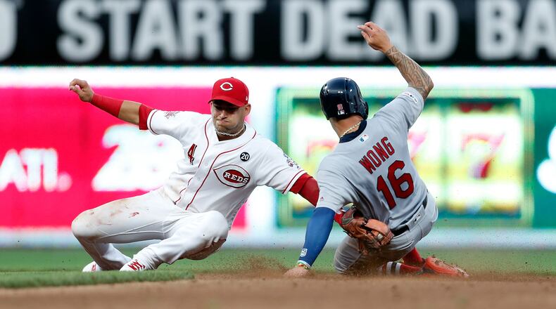 CINCINNATI, OH - JULY 18: Kolten Wong #16 of the St. Louis Cardinals beats the throw to Jose Iglesias #4 of the Cincinnati Reds at second base during the fifth inning at Great American Ball Park on July 18, 2019 in Cincinnati, Ohio. St. Louis defeated Cincinnati 7-4. (Photo by Kirk Irwin/Getty Images)