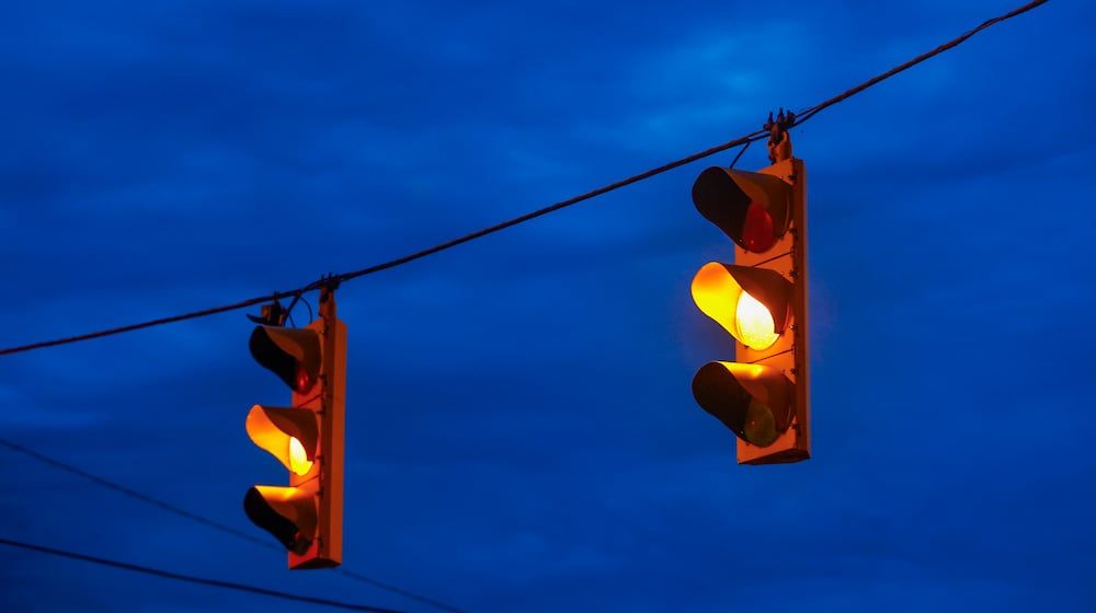 Traffic lights turn yellow at the intersection of Lagonda Avenue and Columbia Street on Monday, November 25, 2025, in Springfield. JOSEPH COOKE/STAFF