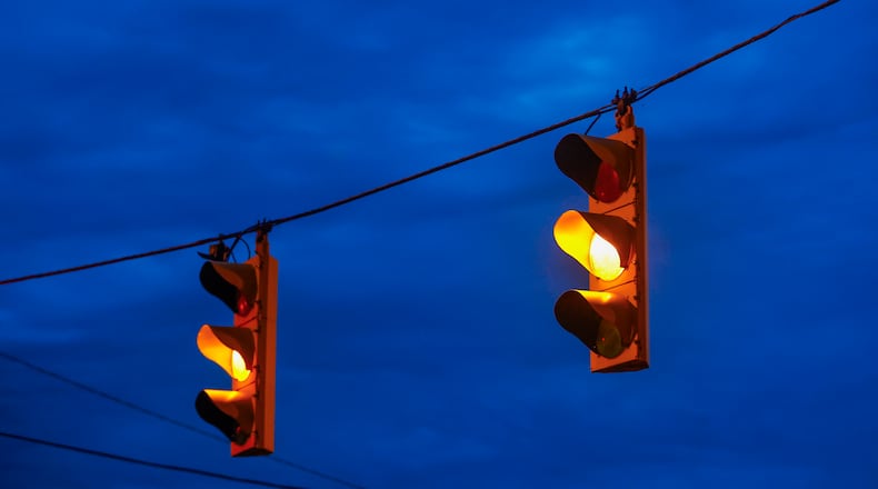 Traffic lights turn yellow at the intersection of Lagonda Avenue and Columbia Street on Monday, November 25, 2025, in Springfield. JOSEPH COOKE/STAFF