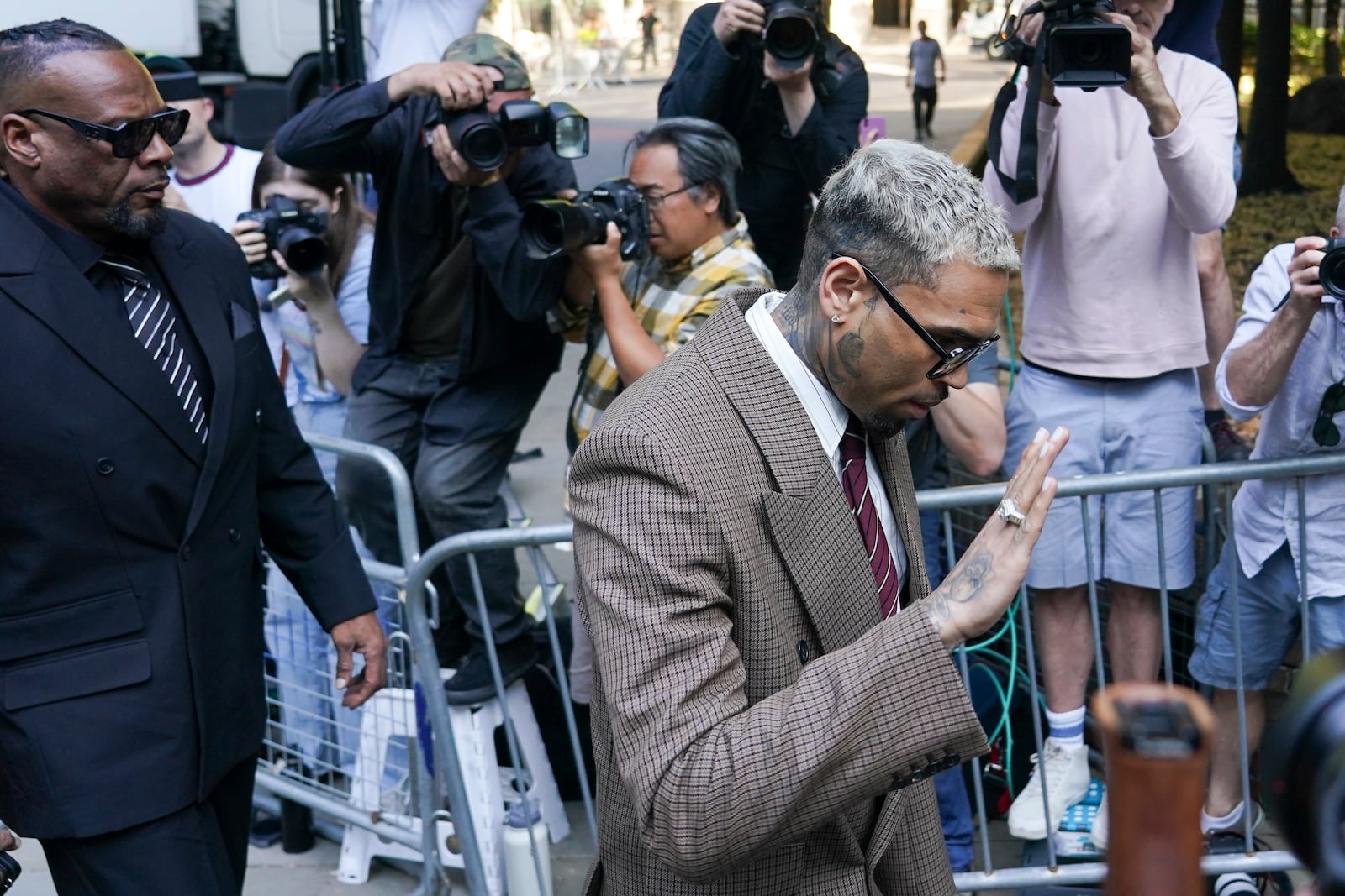 Grammy-winning singer Chris Brown makes his way into Southwark Crown Court, in London, Friday, July 11, 2025.(AP Photo/Alberto Pezzali)