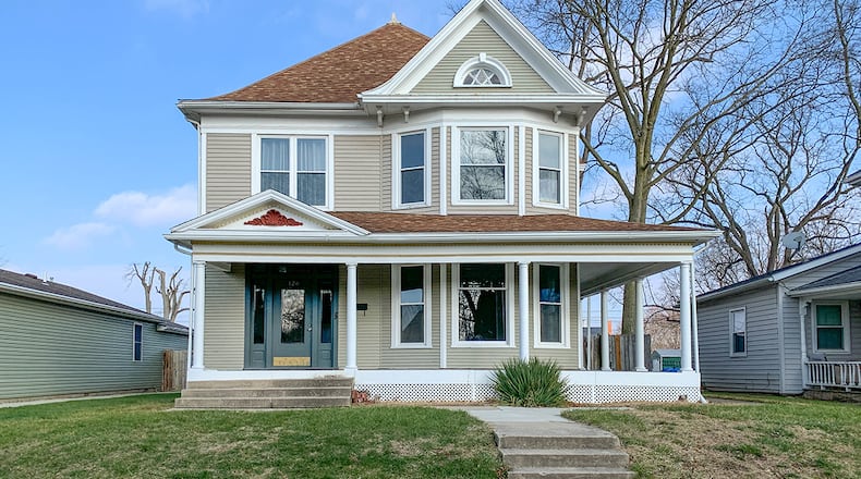 With its wraparound front porch, this home built in 1900 boasts many original details and various updates. The 4-bedroom home has about 2,760 sq. ft. of living space with a 3rd-floor attic space and full, unfinished basement. CONTRIBUTED PHOTO