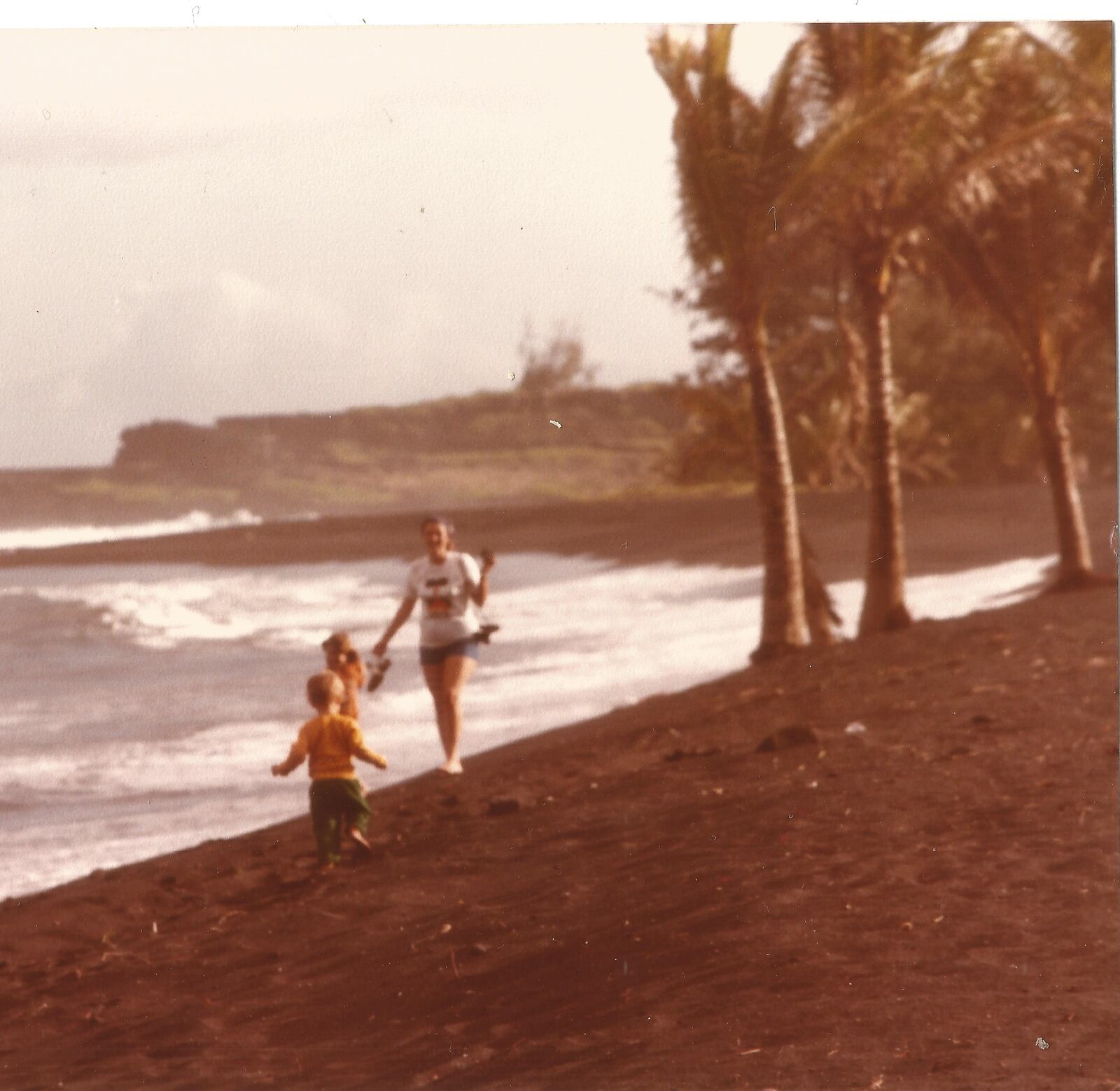 Walking on a Black Sand Beach near Kalapana in 1991 with two of our children. CONTRIBUTED