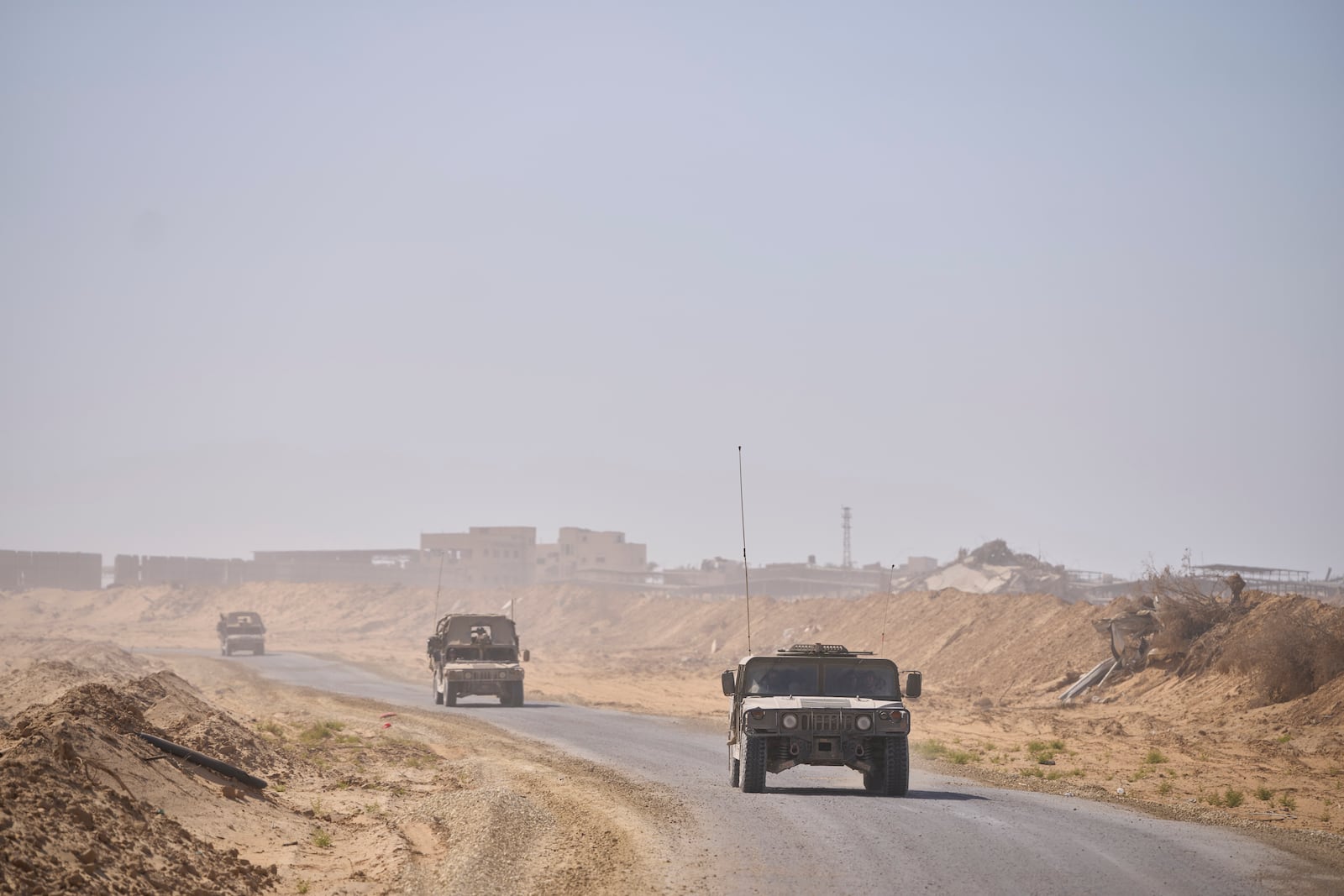 Israeli army vehicles transport a group of soldiers and journalists along the Morag corridor in southern Gaza on June 8, 2025. The Israeli military invited reporters for a tour in the European Hospital in Khan Younis. (AP Photo/Ohad Zwigenberg)